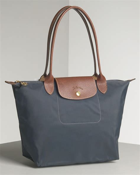 longchamp tote with shoulder strap.